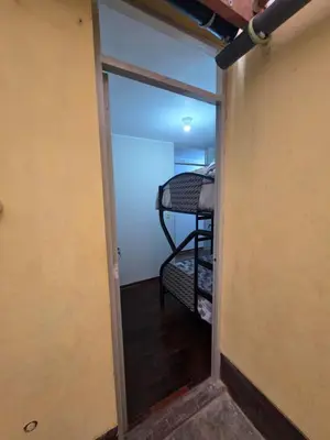 a door leading into a room with a bunk bed at RODRICH apartment 2 in Lima