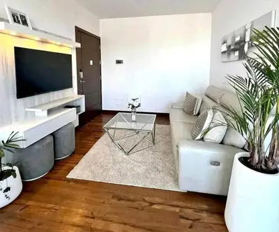 a living room with a couch and a tv at La Panaca Del Inka Apartment in Cusco