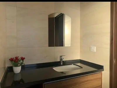a bathroom with a sink and a mirror at Qori Apartment in Cusco