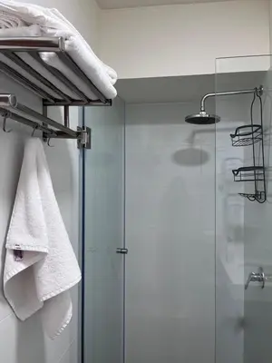 a bathroom with a shower and a glass shower door at APARTMENT NEW COMFORTABLE in MIRAFLORES in Lima