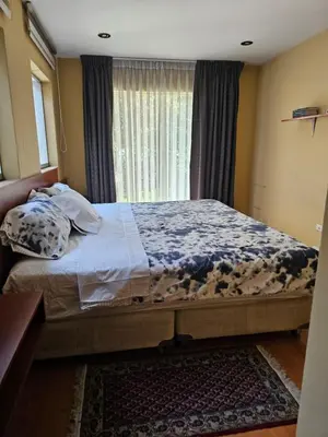 a large bed in a bedroom with a window at CasaHotel Chaclacayo in Chaclacayo