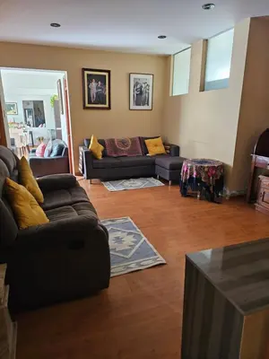 a living room with two couches and a couch at CasaHotel Chaclacayo in Chaclacayo