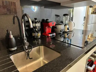 a kitchen counter top with a sink in a kitchen at Apartamento familiar 3 habitaciones, piscina cerca a Miraflores in Lima