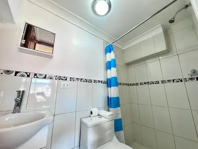 a bathroom with a toilet and a sink at Libertrek in Cusco