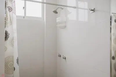 a bathroom with a shower with a shower curtain at Charming 3BR in Barranco in Lima