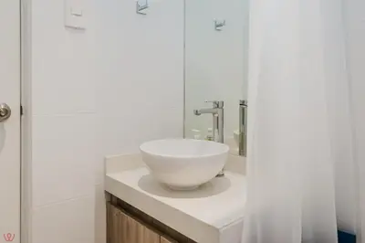 a bathroom with a white bowl sink on a counter at Charming 3BR in Barranco in Lima