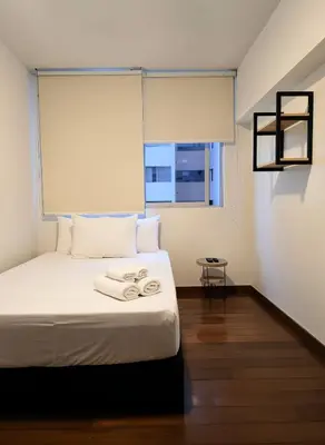 a bedroom with a bed with two towels on it at E LarcomarZone Sea View All Inclusive 3B 701 in Lima