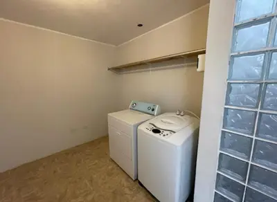 a washer and dryer in a laundry room with a window at House in Barranco, Hot Tub & Rooftop Cinema, 11 P in Lima
