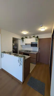 a large kitchen with a counter in a room at Descanso en Oscuridad Absoluta in Lima