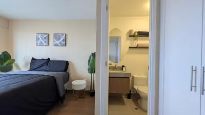 a bedroom with a bed and a sink and a toilet at Descanso en Oscuridad Absoluta in Lima