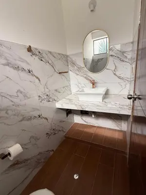 a bathroom with a sink and a mirror at Casa los Cipreses del Sol in Cieneguilla