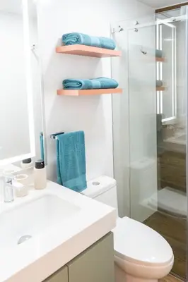 a bathroom with a toilet and a glass shower at Miraflores La Mar in Lima