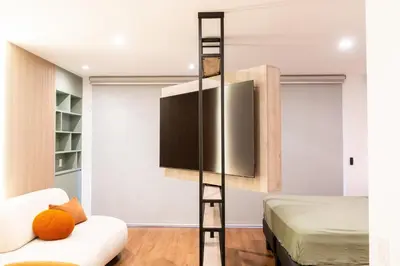 a room with a tv and a bed at Miraflores La Mar in Lima