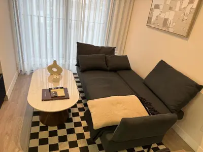 a living room with a couch and a table at Art10 Milu - Miraflores-Larcomar in Lima