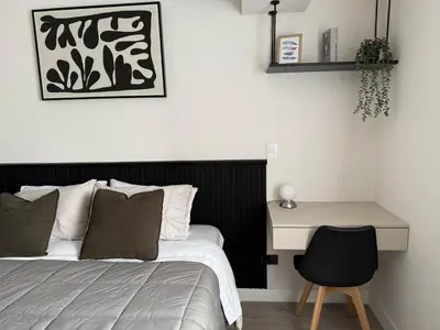 a bedroom with a bed and a desk at Art10 Milu - Miraflores-Larcomar in Lima