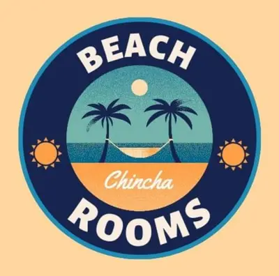 a round sign with palm trees and a hammock at Beach Rooms Chincha in Tambo de Mora