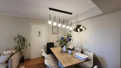 a dining room with a table and chairs at Beautiful and spacious apartment in San Felipe in Lima