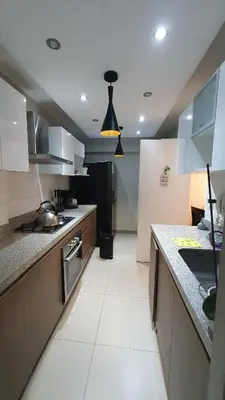 a kitchen with a sink and a counter top at Beautiful and spacious apartment in San Felipe in Lima