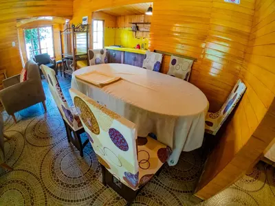 a dining room with a table and chairs at Kay Pacha Wellness Place Eco in Ayacucho