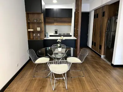 a dining room with a glass table and chairs at 2 Bedroom Apartments San Isidro Business Zone in Lima