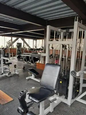 a gym with a chair and other equipment at Habitación acogedora amoblada in Lima