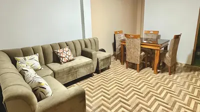 a living room with a couch and a table at WIFI Rápido A 20 min del Aeropuerto de Lima in Lima