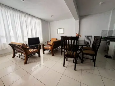 a living room with a table and chairs and a piano at RELAX Y PISCINA con vista al MAR - DUPLEX in Cerro Azul