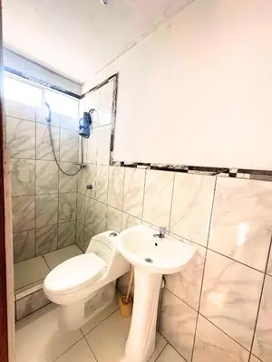 a bathroom with a toilet and a sink at RELAX Y PISCINA con vista al MAR - DUPLEX in Cerro Azul