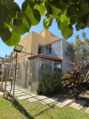 a house with a fence in front of it at Casita en Ica con piscina in Ica