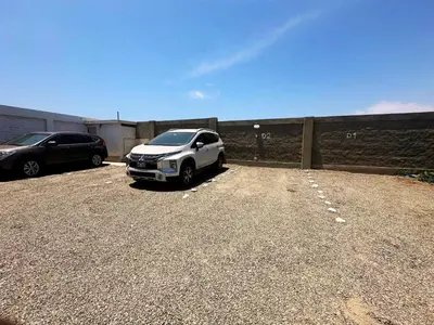 a white car parked in a parking lot at RELAX Y PISCINA con vista al MAR - FLAT in Cerro Azul