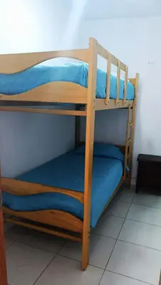 a couple of bunk beds in a room at RELAX Y PISCINA con vista al MAR - FLAT in Cerro Azul