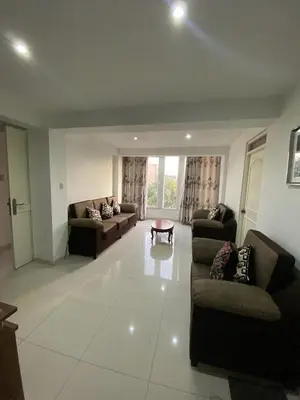 a large living room with couches and a table at Beautiful Complete Apartment in Lima