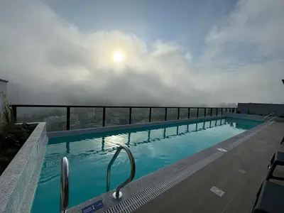 a swimming pool on the roof of a building at Premium apartment in Miraflores with rooftop pool in Lima