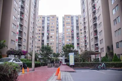 a parking lot in a city with tall buildings at Hermoso apartamento cerca al estadio San Marcos y el Aeropuerto in Lima