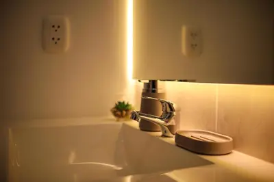 a bathroom sink with a lamp on top of it at Brand new apartment in Olivar of San Felipe in Lima