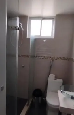 a bathroom with a toilet and a window at Alojate en Mala casa del valle in Mala