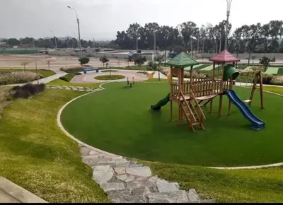 a playground with a slide in a park at Alojate en Mala casa del valle in Mala