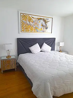 a bedroom with a large bed and two lamps at Apartment modern full 3BR near Larcomar, Miraflores, Lima, Peru Sunset all days in Lima