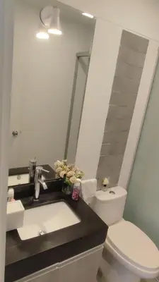 a bathroom with a sink and a toilet and a mirror at Apartment modern full 3BR near Larcomar, Miraflores, Lima, Peru Sunset all days in Lima