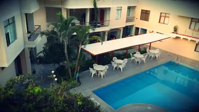 an aerial view of a hotel with a swimming pool at Belle Sand Hotel in Ica
