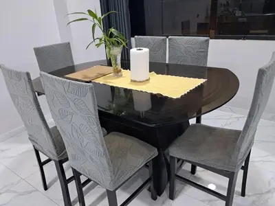 a black table with chairs and a candle on top at Alojamiento Flower House in San Antonio
