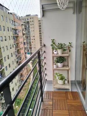 a balcony with potted plants on shelves on a building at Adriana in Lima