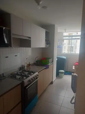 a kitchen with a stove top oven in a room at Alto Alborada Cercado in Lima