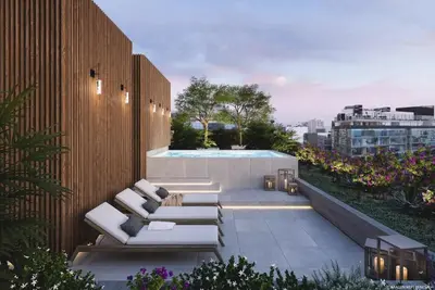 a rooftop patio with white couches and a pool at Elegant and cozy 2BR in Miraflores by Eco28 in Lima