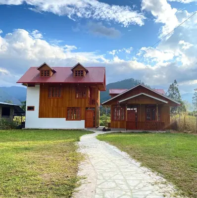 a house with a pathway in front of it at Cabañas Don Ceferino in Palmira