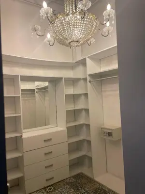 a walk in closet with a chandelier at Miraflores Penthouse in Lima