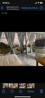 a television screen with a picture of a room at Miraflores Penthouse in Lima