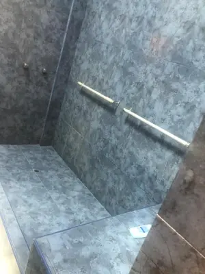a shower with two metal bars on the floor at Miraflores Penthouse in Lima