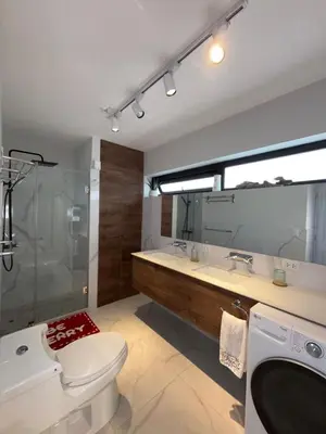 a bathroom with a toilet and a shower and a sink at Mar Private Rooms in Lima