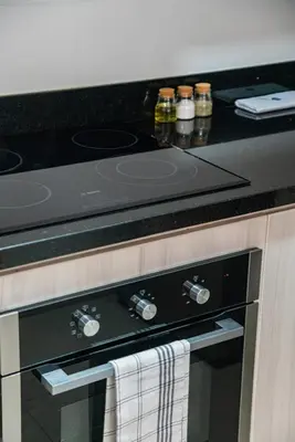 a stove top oven with a towel hanging from it at Elmora 2BR by Geko in Lima
